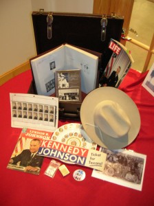 Artifacts from LBJ's traveling trunk, showing his hat, photos and campaign materials