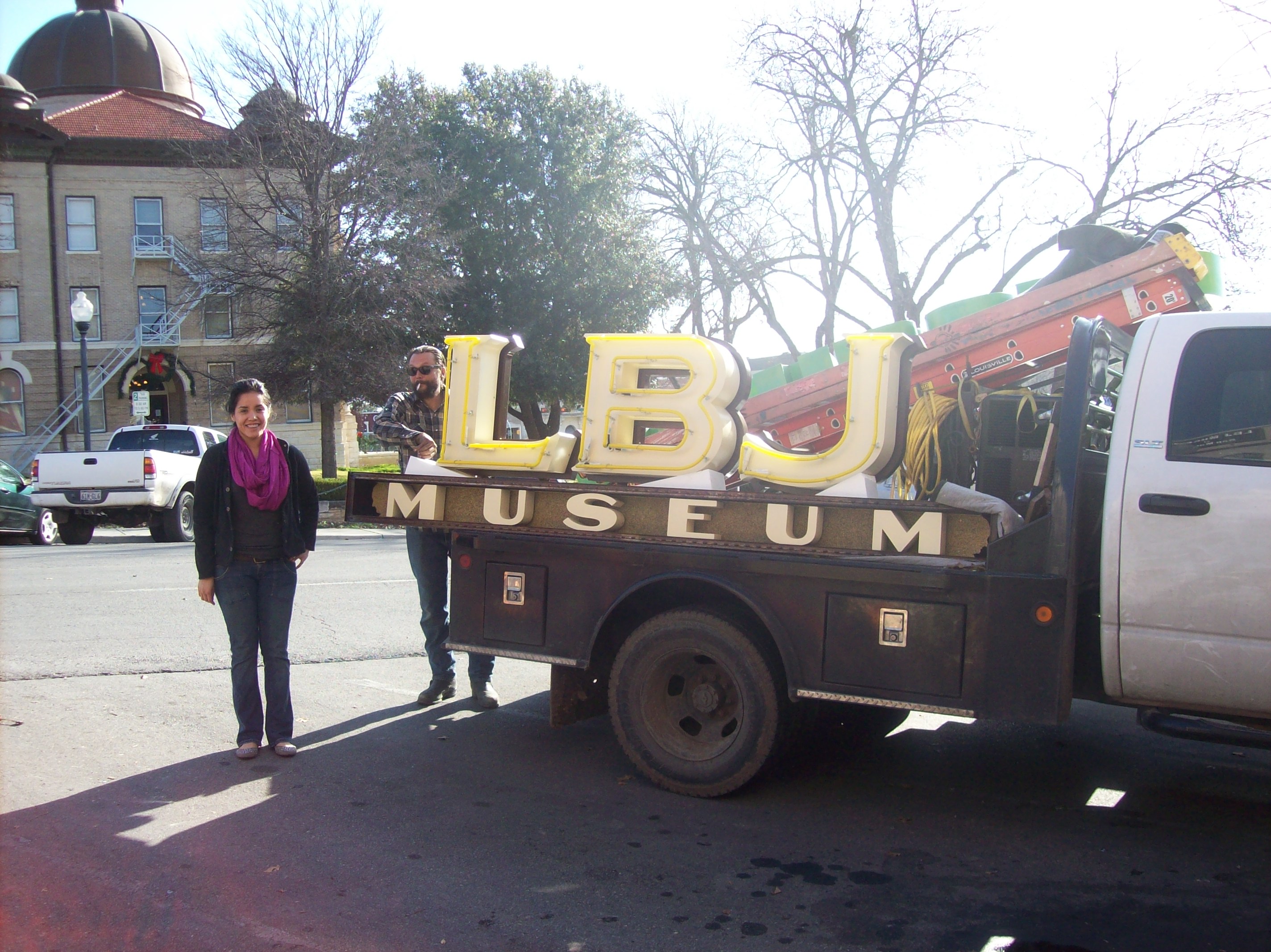 LBJ Museum sign is taken off of a delivery truck.